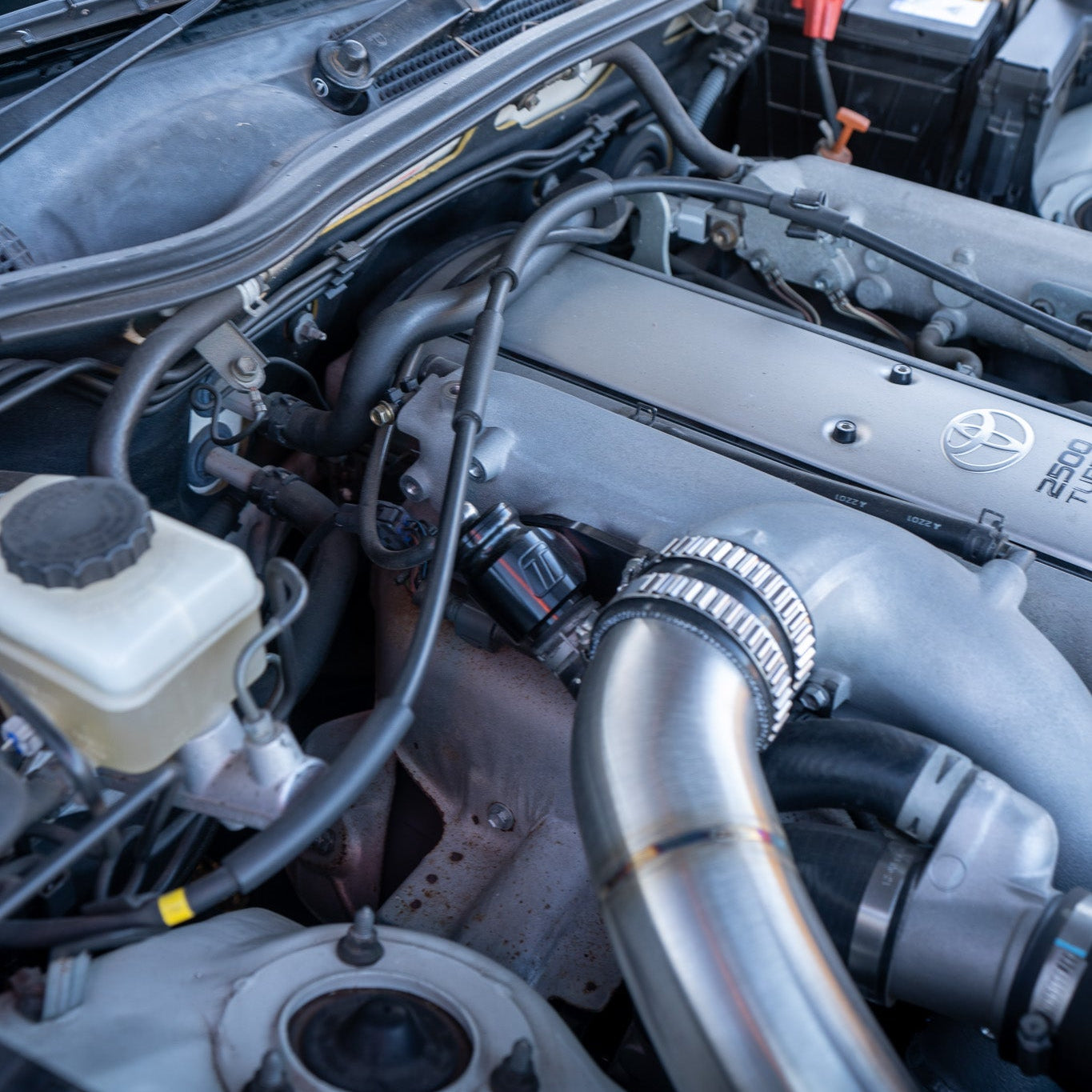 Close-up of a car engine with visible brand logo